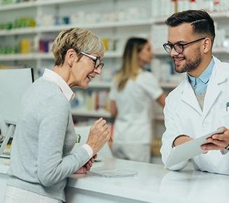 male pharmacist with customer