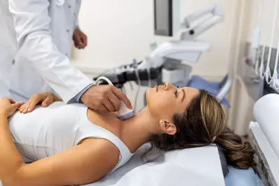 woman getting thyroid checked