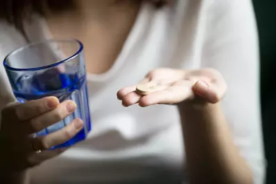 woman taking pill