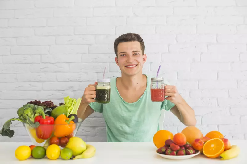 man holding healthy smoothies