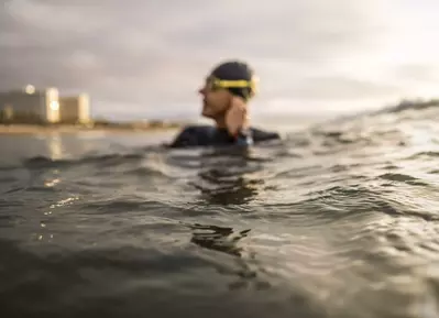 man in water with goggles