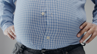 overweight man with shirt unbuttoned