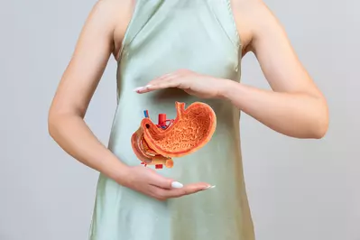 woman holding stomach