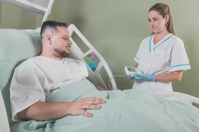 man in hospital bed